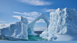 image of anarctic ice float and title below The Hidden Synthetic Cloud Altering Antarctica’s Untouched Valleys